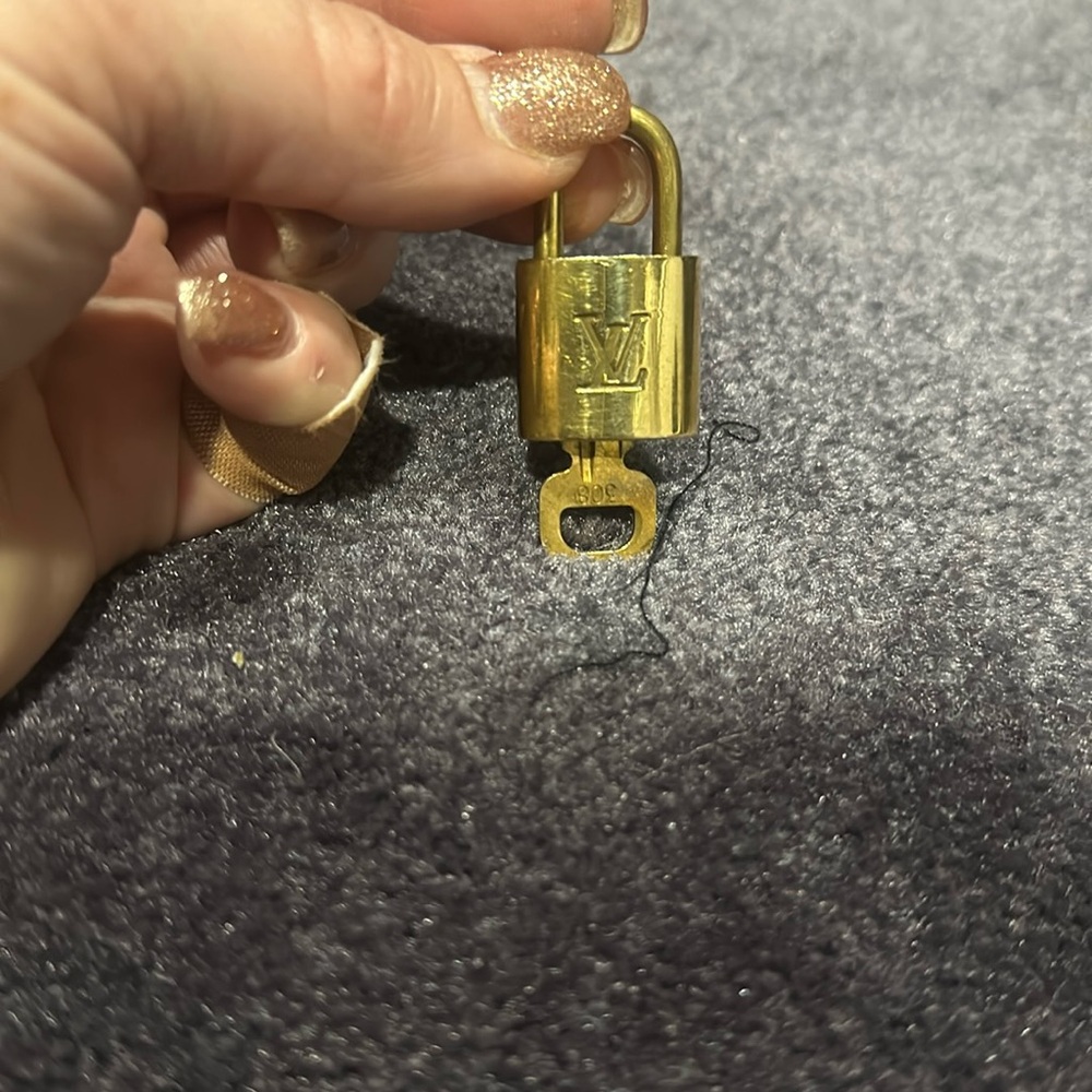 #308…Unisex Original LV branded brass lock and key.